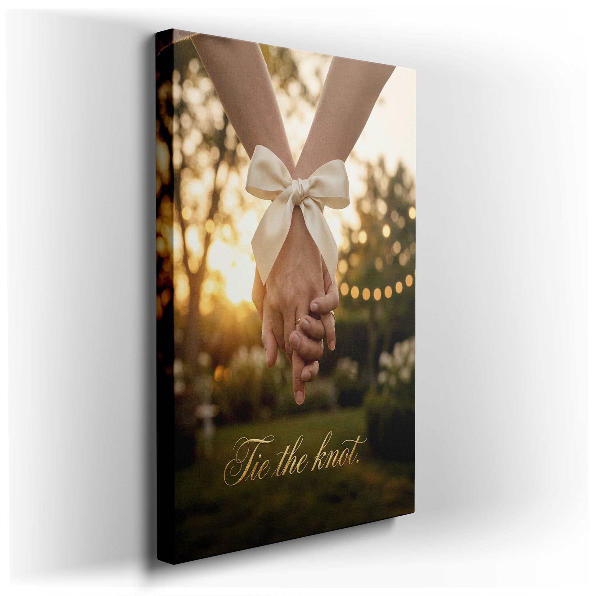 Close-up of intertwined hands tied with a satin bow, a romantic Wrapped Canvas for home decor.