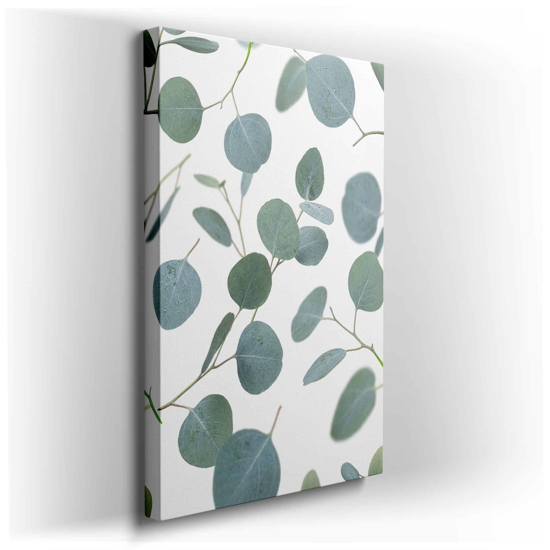 Eucalyptus leaves wall art displays scattered silver-green leaves on a white backdrop creating a fresh, botanical design.