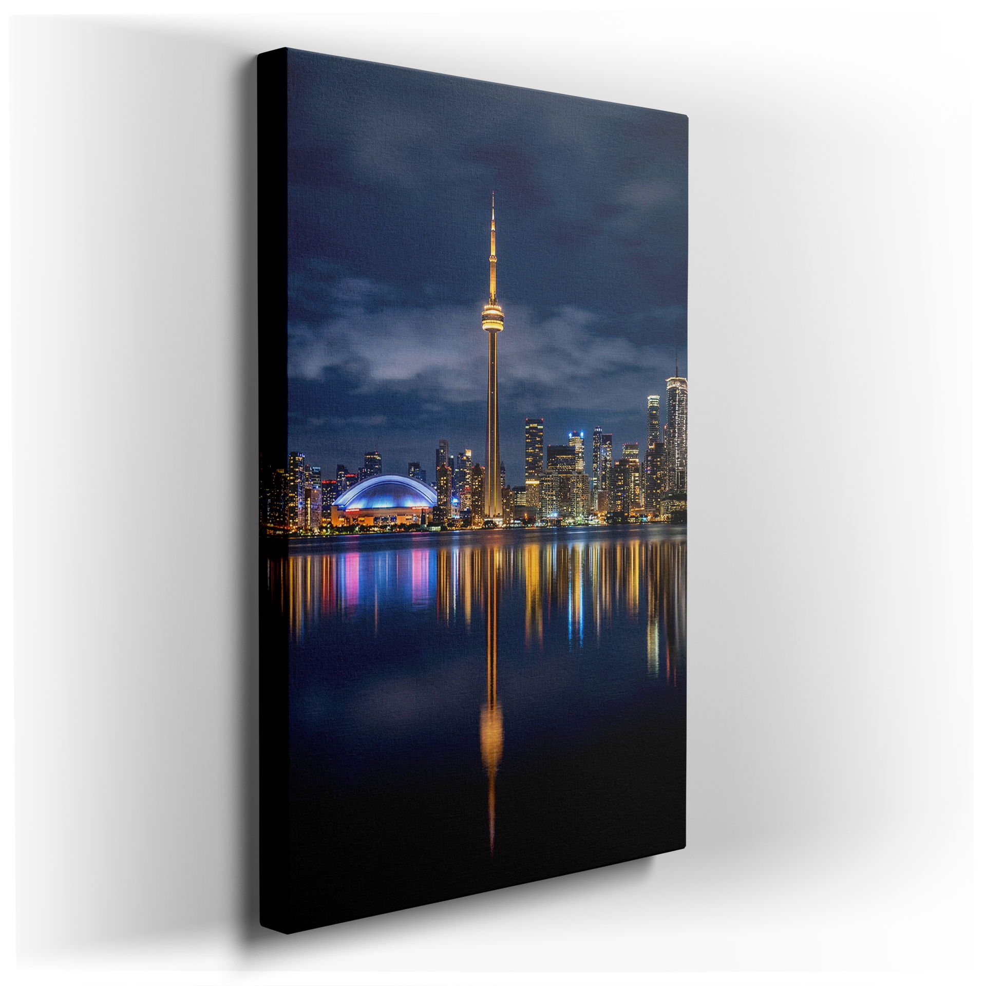 Toronto skyline wall art at night, city lights reflecting off the water and featuring the CN Tower. A stunning piece of wall decor.