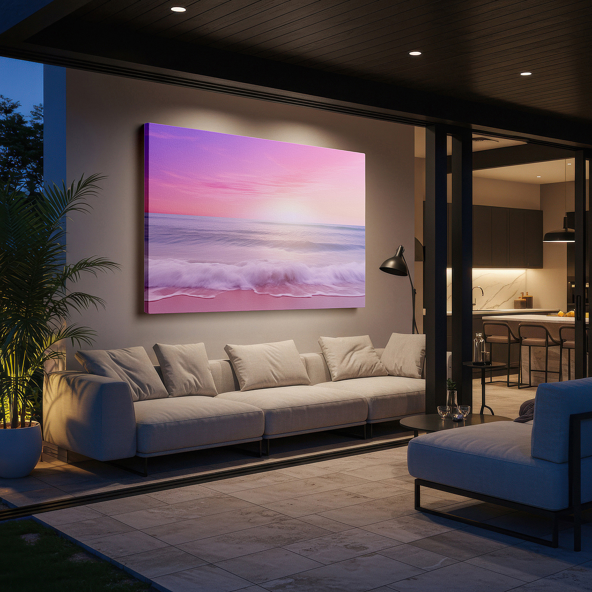 Displayed above a contemporary leather sofa in warm light — serene ocean sunset featuring gentle pink and purple tones above peaceful waters - large canvas wall art for home and office decor