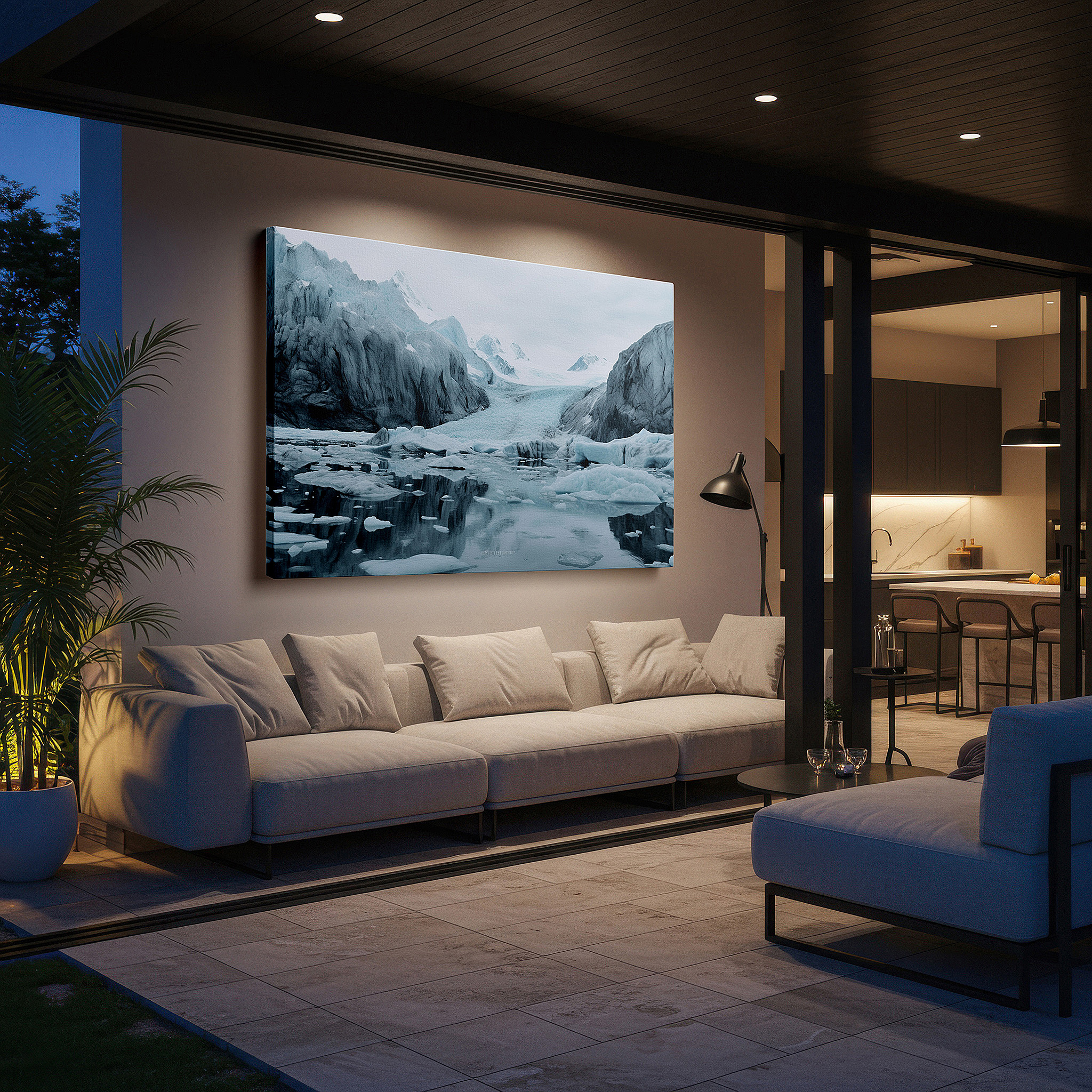 Displayed above a contemporary leather sofa in warm light — stunning glacial scenery featuring imposing icebergs under cloudy skies - large canvas wall art for office and bedroom decor