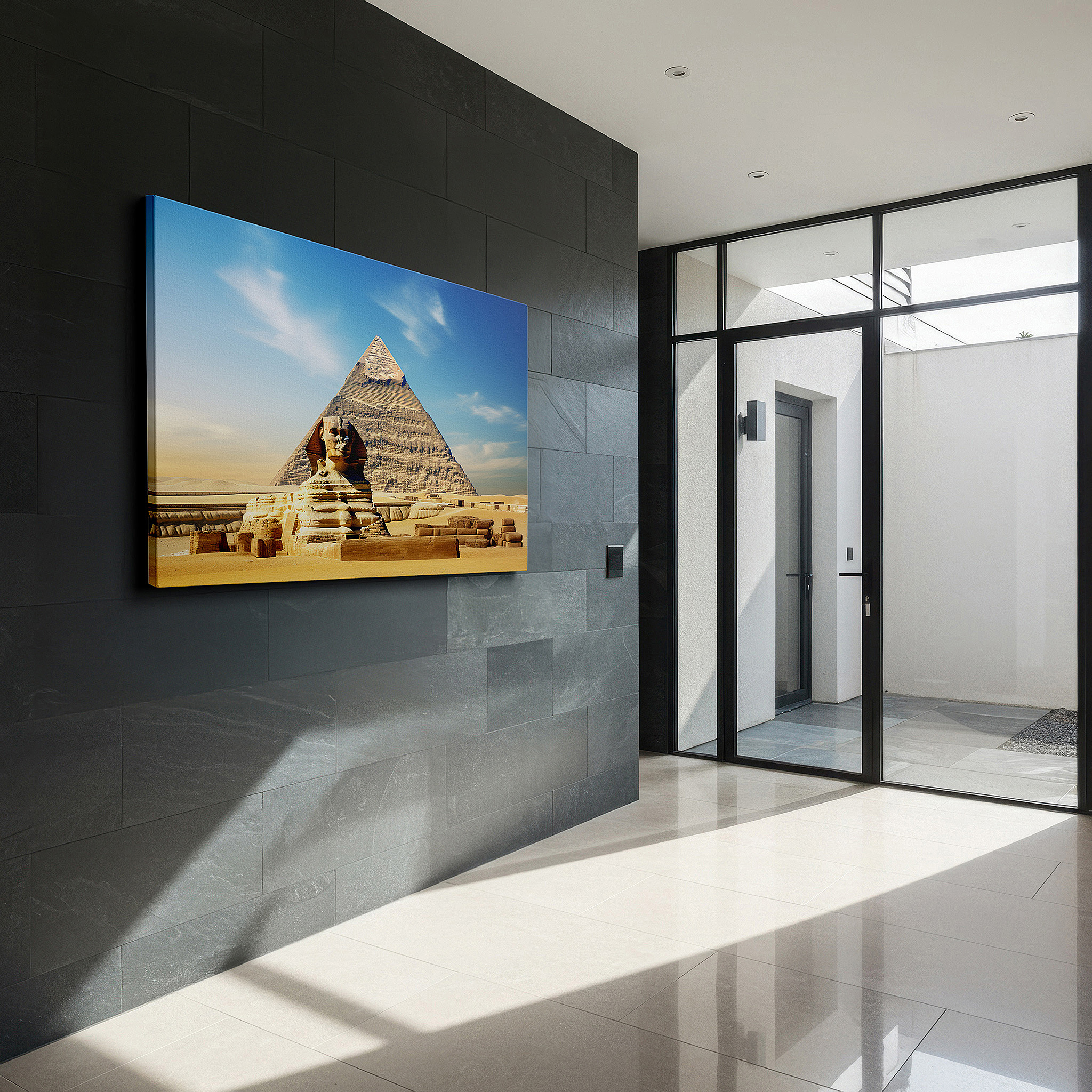 Gently illuminated by ambient lighting in an entryway — wall art: majestic sphinx and pyramid beneath a bright blue sky - a tribute to the wonders of ancient egypt, large canvas wall art for home and office decor