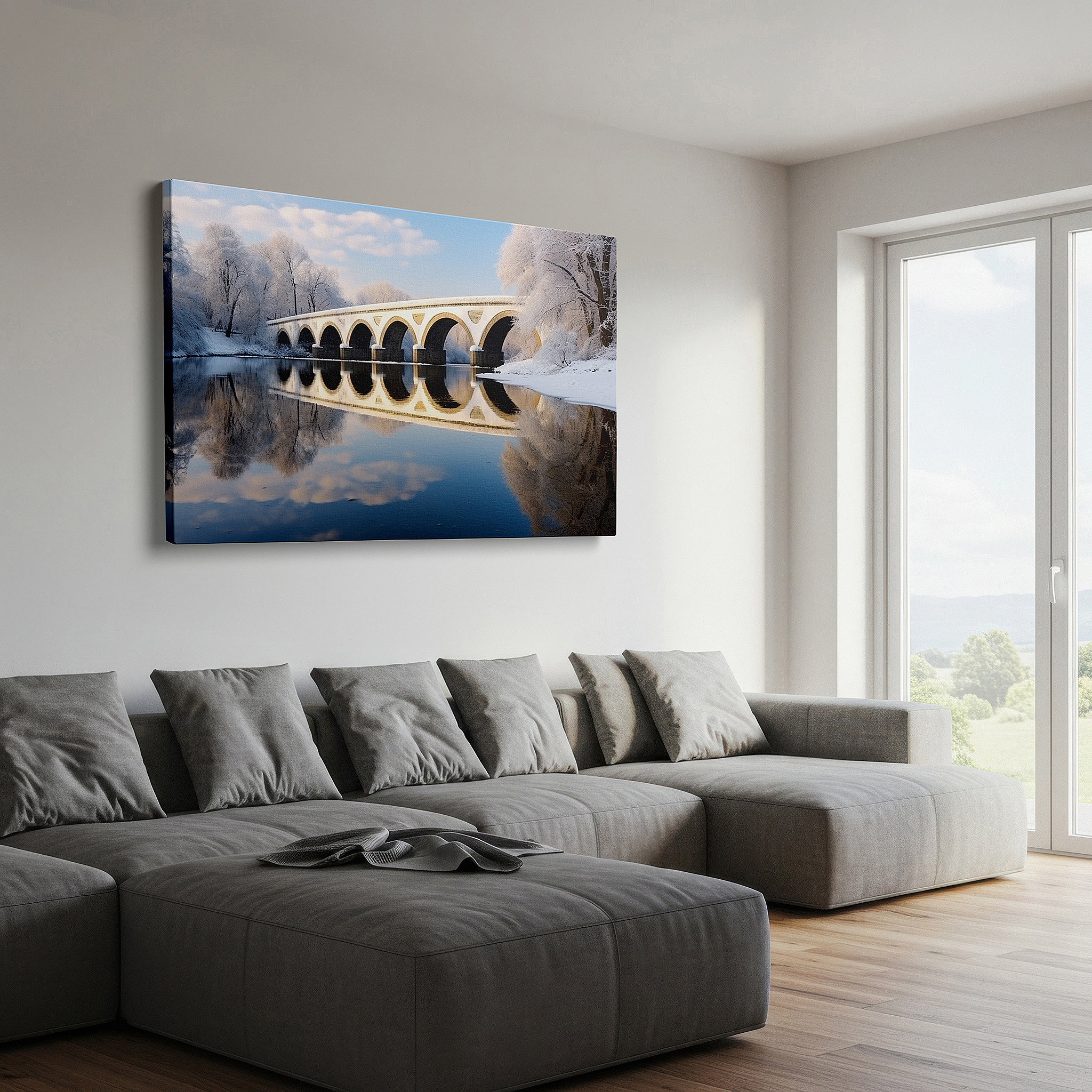 Hung in a cozy reading nook beside a floor lamp and bookshelf — serene winter scene with graceful arch bridge over calm waters - large canvas wall art for office and bedroom decor