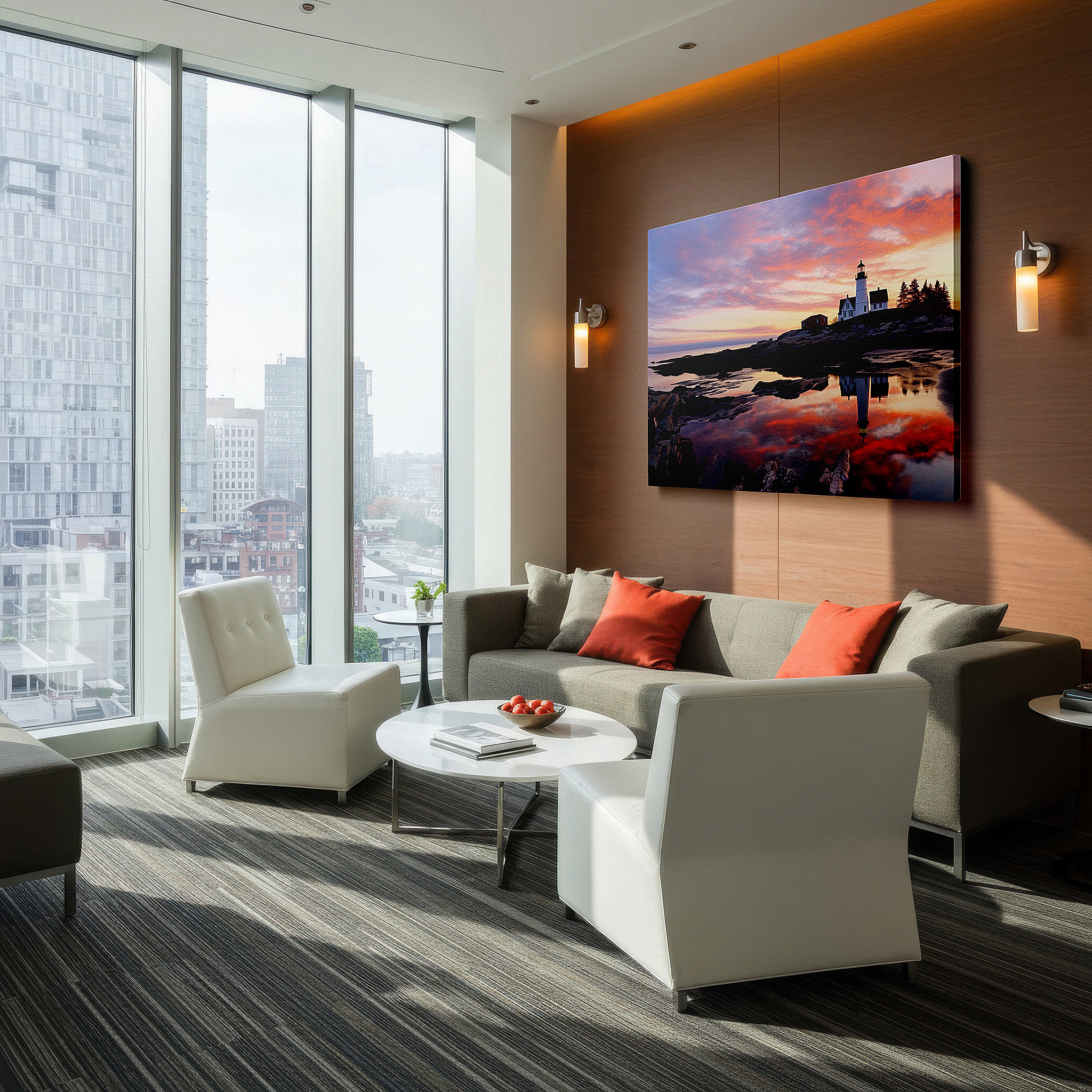 Displayed above a contemporary leather sofa in warm light — stunning lighthouse canvas wall art: a symbol of guidance against a vibrant coastal sunset, perfect for home decor