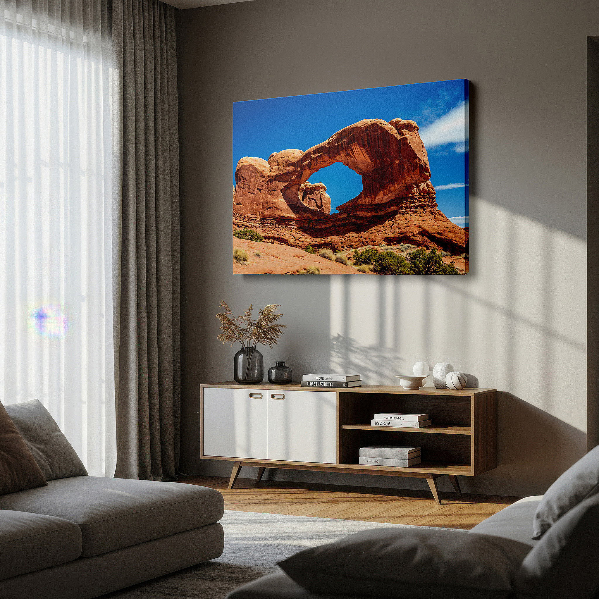 Hung in a cozy reading nook beside a floor lamp and bookshelf — wall decor: majestic arches national park - gateway to timeless natural beauty and adventure. large canvas wall art for home and office decor.