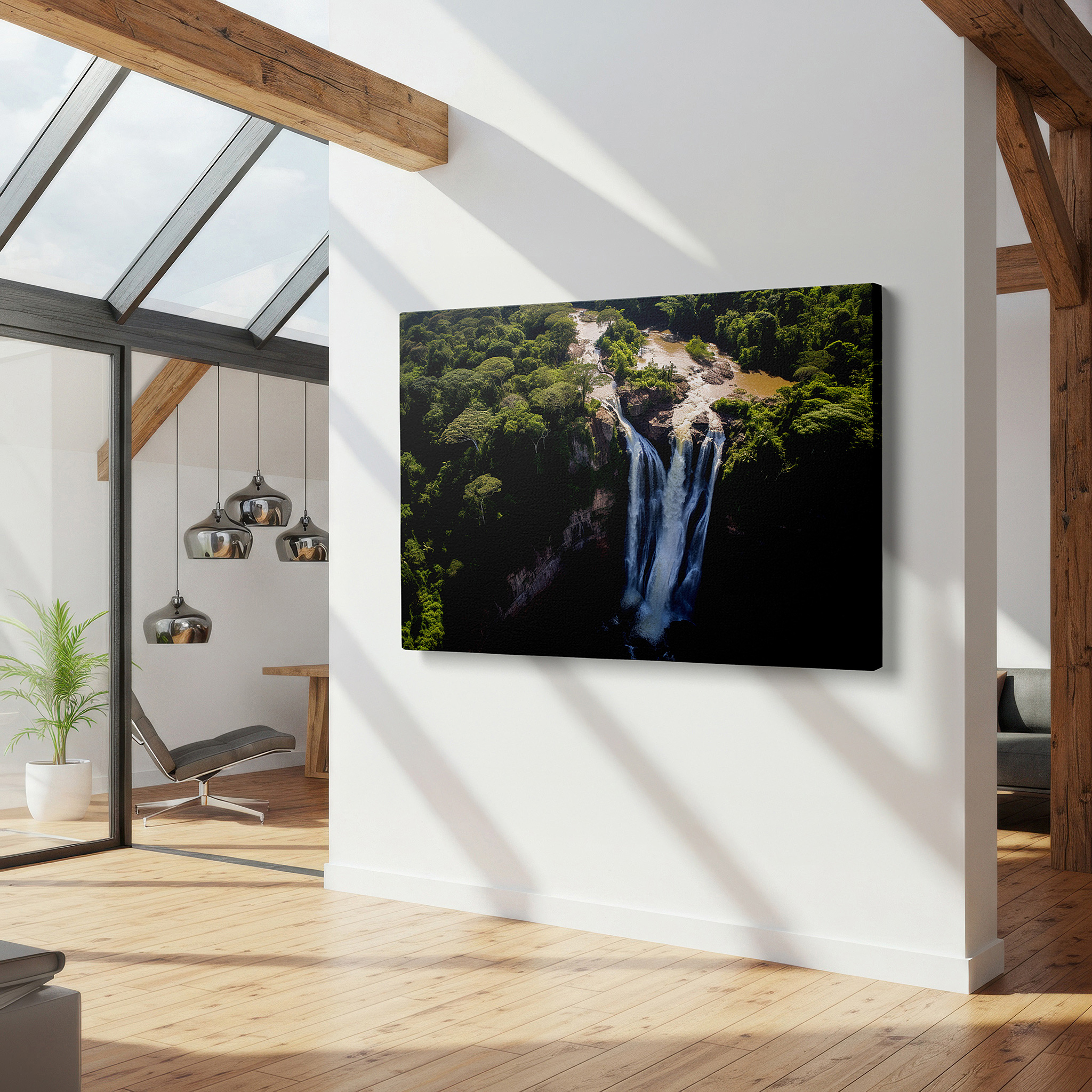Set in a minimalist interior with textured walls and soft rugs — aerial view of majestic waterfall in lush rainforest, large canvas wall art for office and bedroom decor