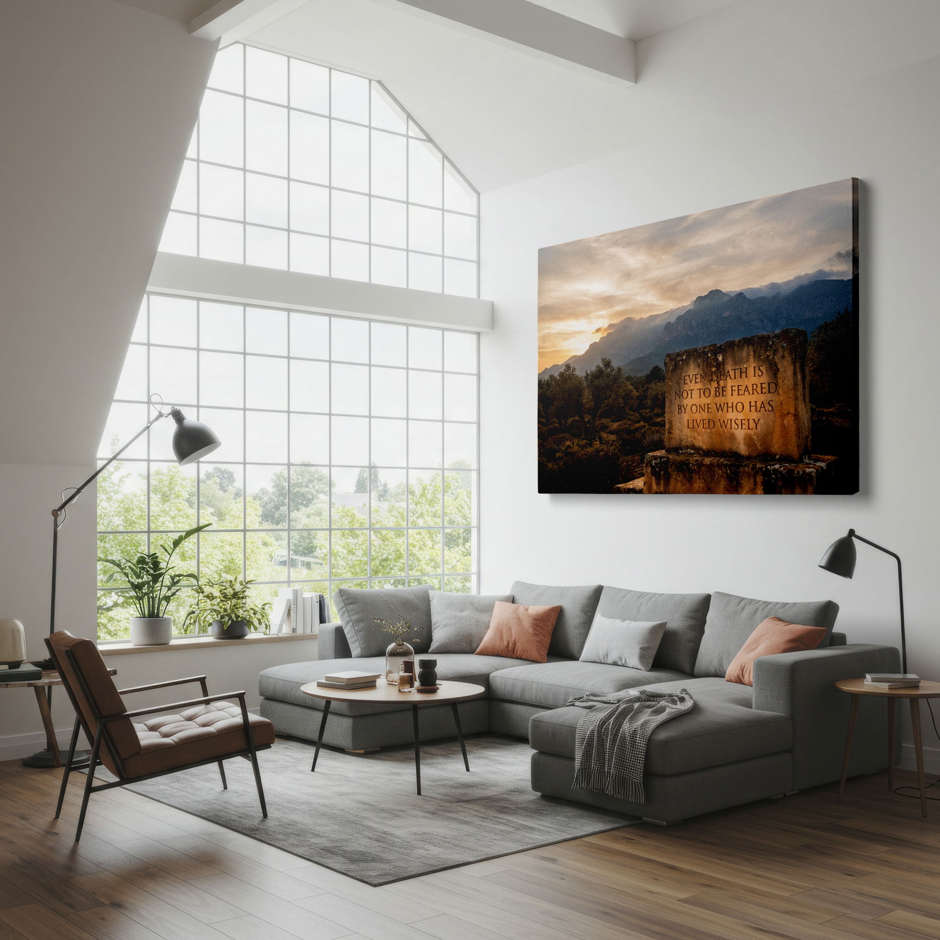 Canvas wall decor shows quote etched on a stone with distant mountains and a sunset.