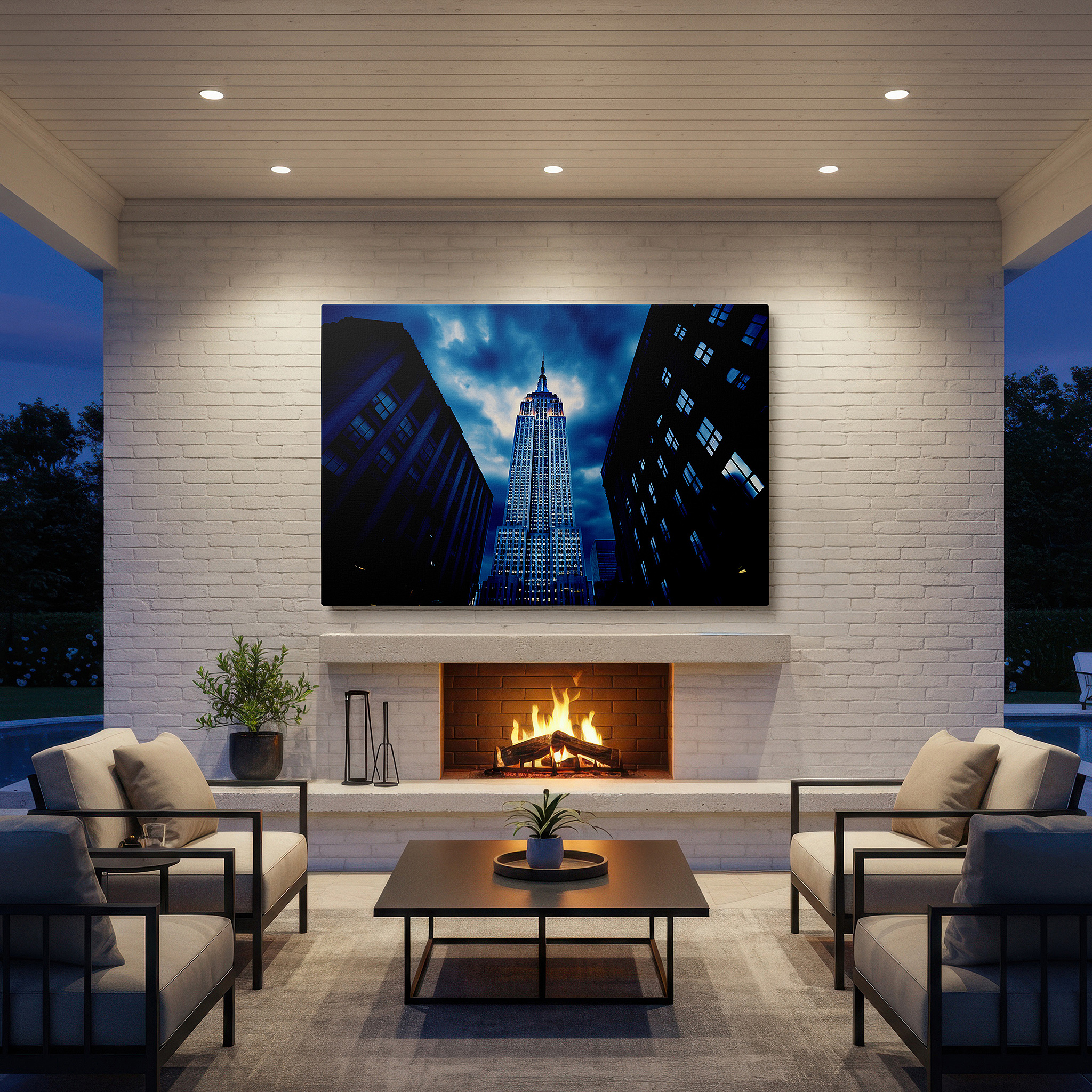 Hung in a cozy reading nook beside a floor lamp and bookshelf — empire state building against a dramatic night sky: a tribute to new york's architectural grandeur and ambitious essence - large canvas wall art