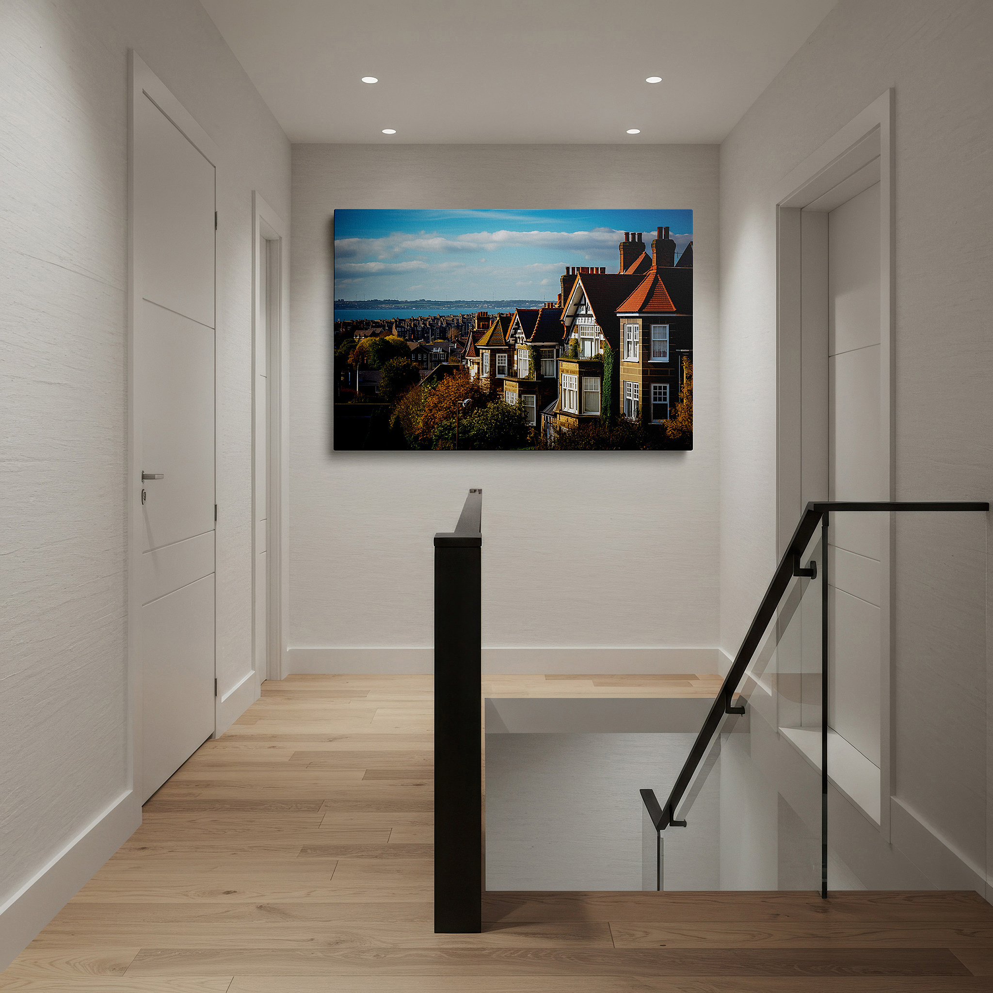 Hung in a cozy reading nook beside a floor lamp and bookshelf — serene coastal village canvas with sunlit homes and blue sea - large wall art for office, bedroom, and living room decor