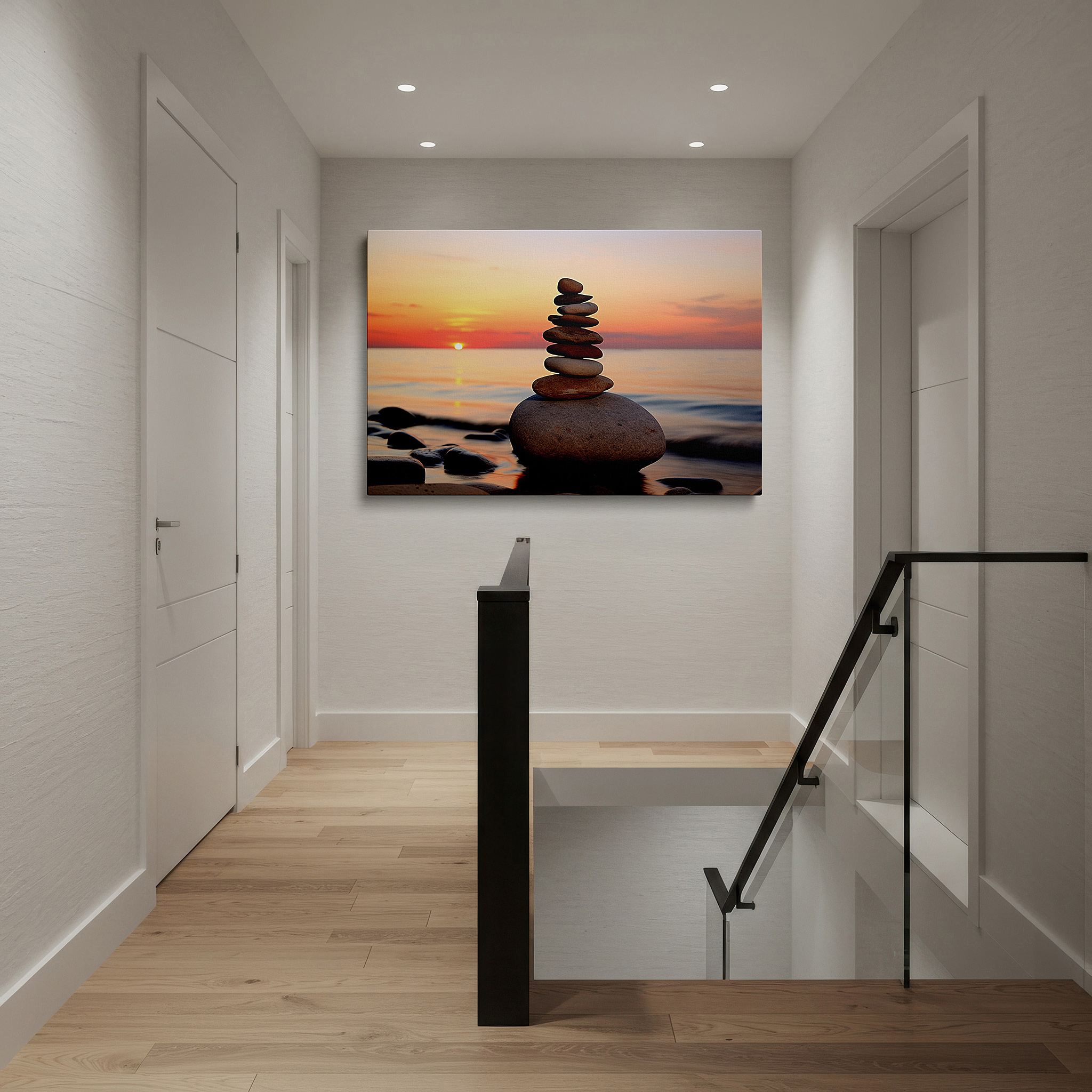 Hung in a cozy reading nook beside a floor lamp and bookshelf — wall art: serene beach stones at dusk - perfectly balanced and peaceful large canvas art for home and office decor