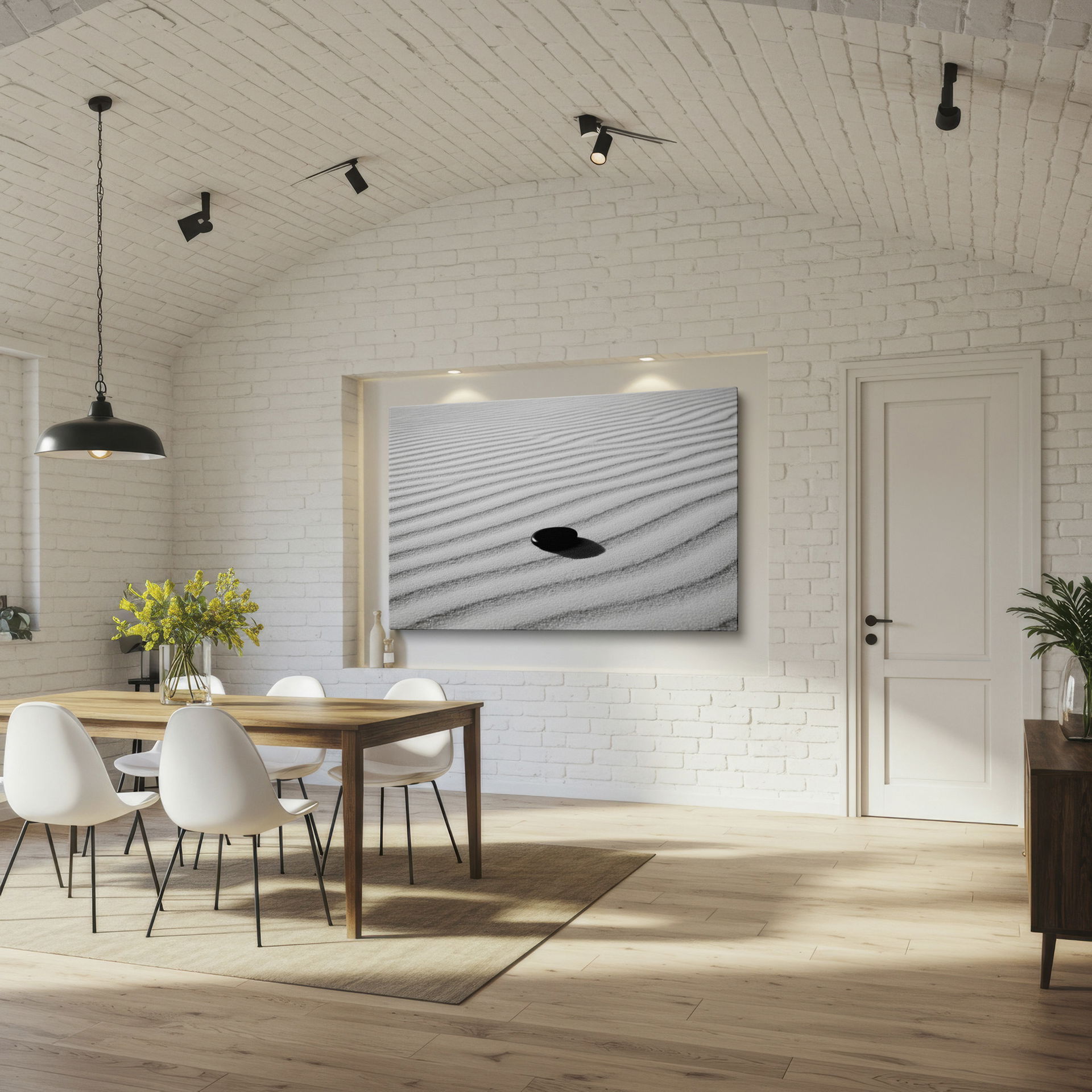 Subtle shadows enhance the dark zen stone on raked white sand in this minimalist wall art.
