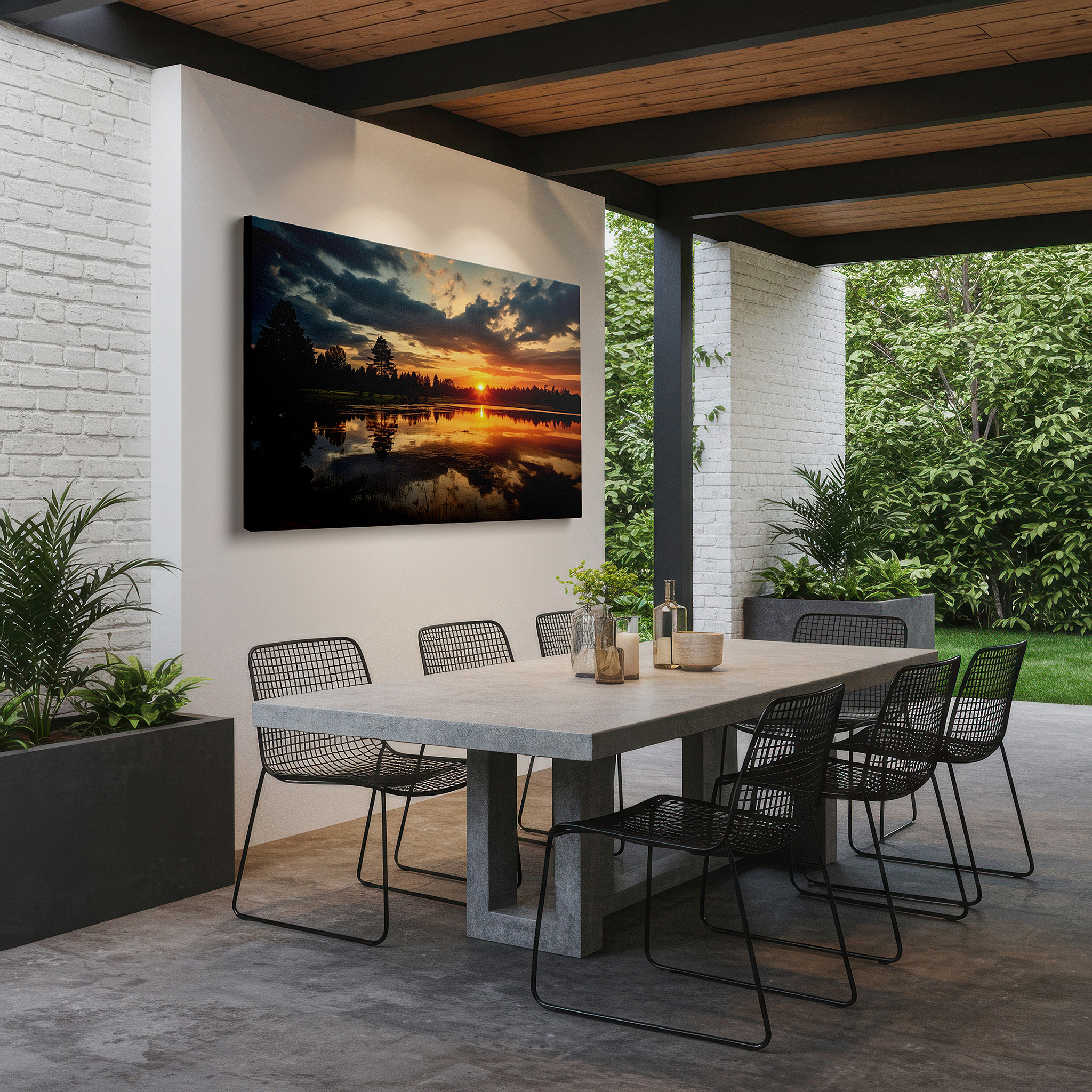 Balanced between two tall indoor plants near a window — dramatic sunset over reflective pond surrounded by lush trees large wall art, canvas wall art, wall decor for office, bedroom, and living room