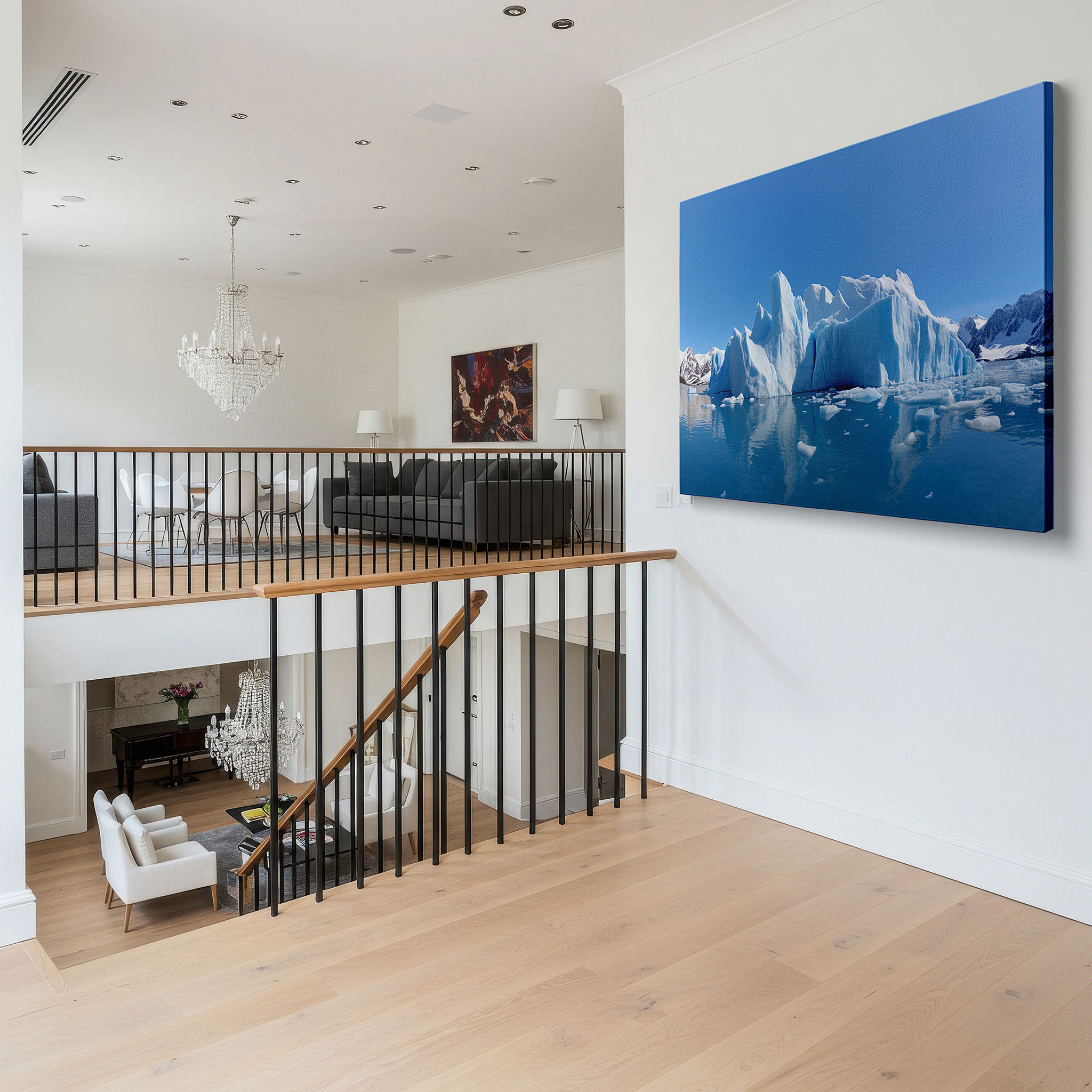 Featured in a dining room with dark wood furniture and candlelight — stunning iceberg reflection in peaceful polar waters beneath a clear blue sky - large wall art, canvas wall art, wall decor for office and bedroom
