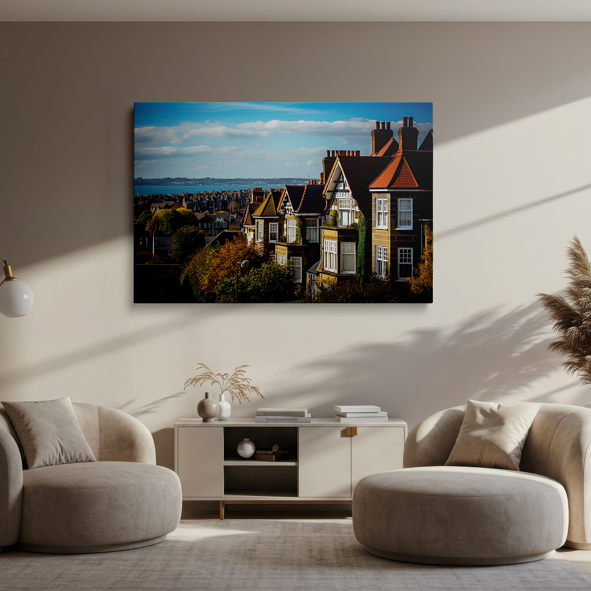Framed by abstract decor and natural-toned accessories — serene coastal village canvas with sunlit homes and blue sea - large wall art for office, bedroom, and living room decor