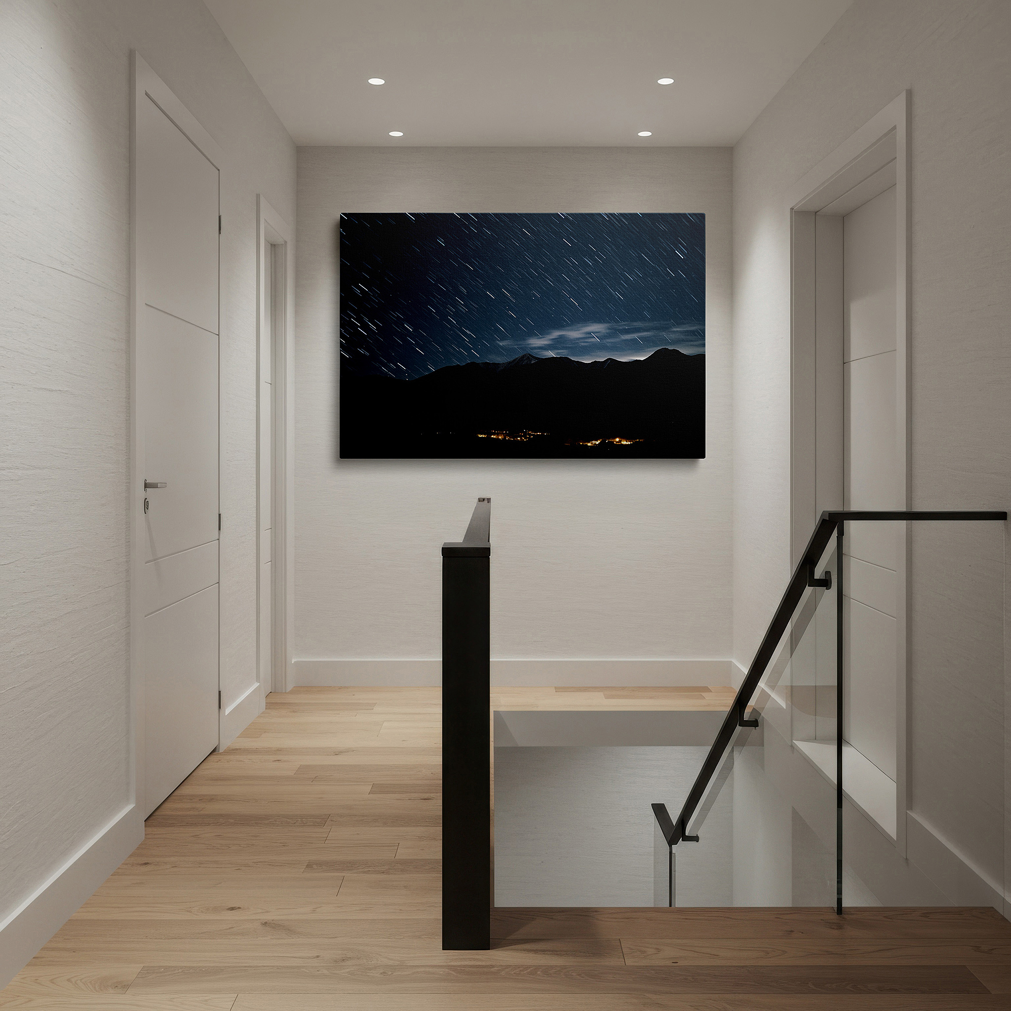 Gently illuminated by ambient lighting in an entryway — star trails above rugged mountains - blending celestial movement with natural scenery, large canvas wall art for home and office decor