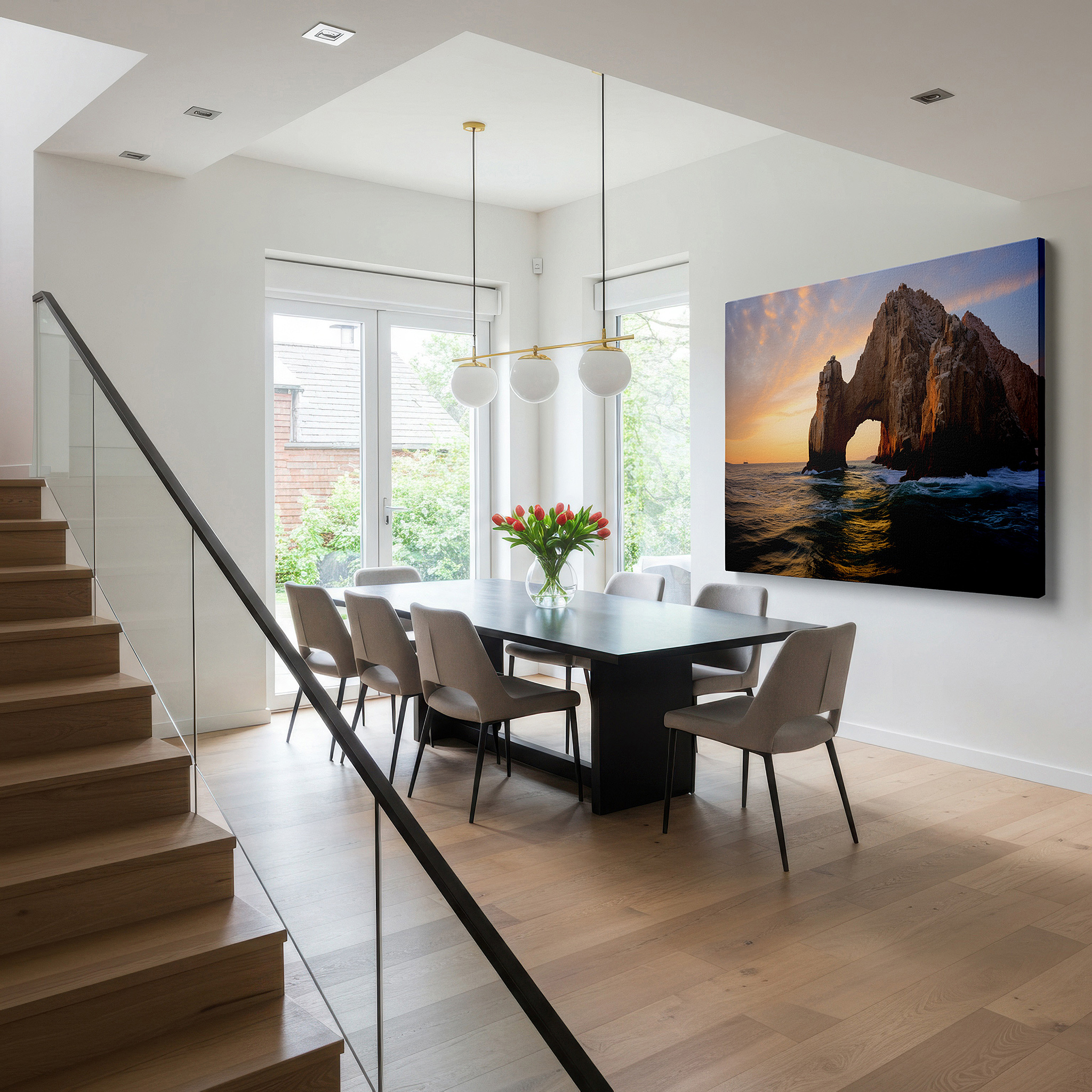Hung in a cozy reading nook beside a floor lamp and bookshelf — wall art: stunning ocean-edge rock formation bathed in sunset's glow - large canvas wall art for office, bedroom, and living room decor