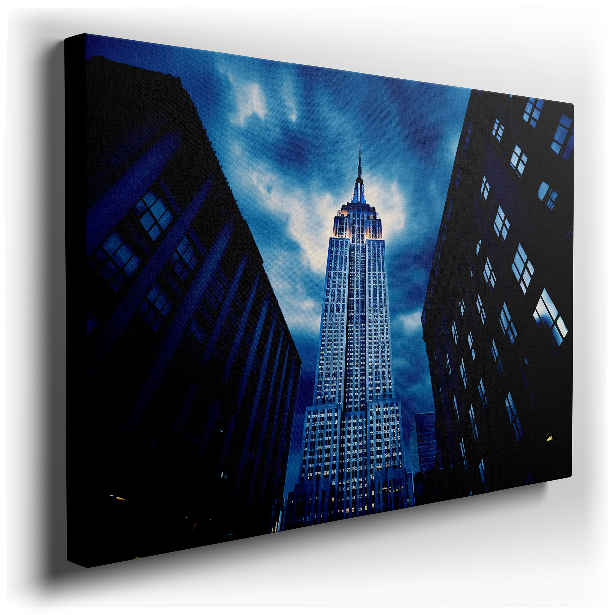 Empire State Building Against a Dramatic Night Sky: A Tribute to New York's Architectural Grandeur and Ambitious