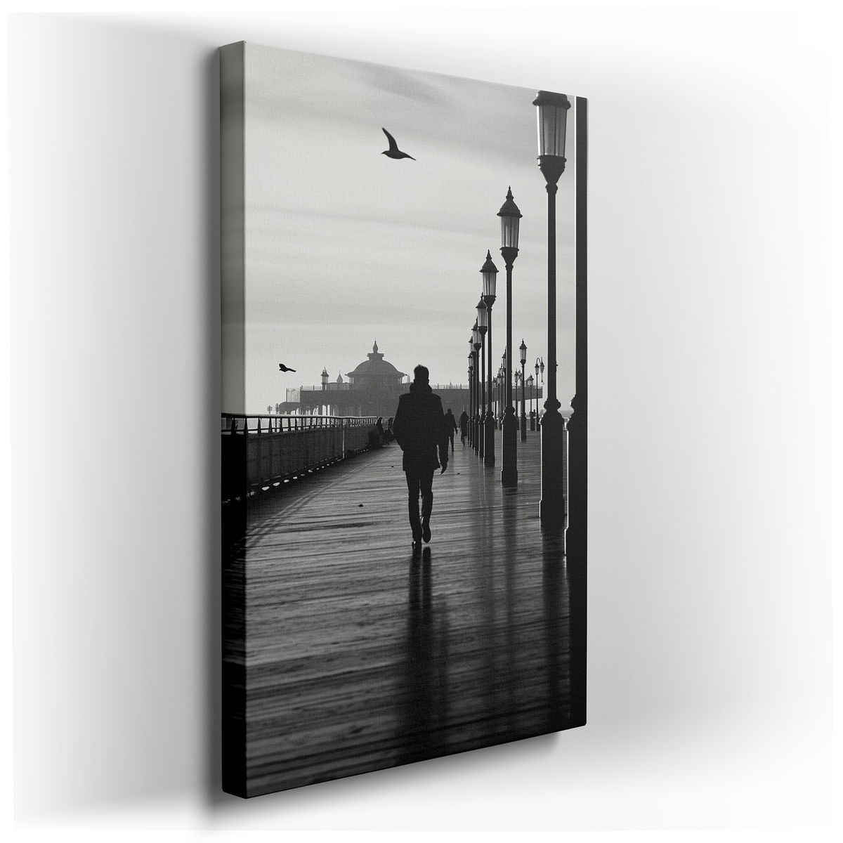 A Lone Figure on an Ageless Pier - Black and White Canvas Wall Art